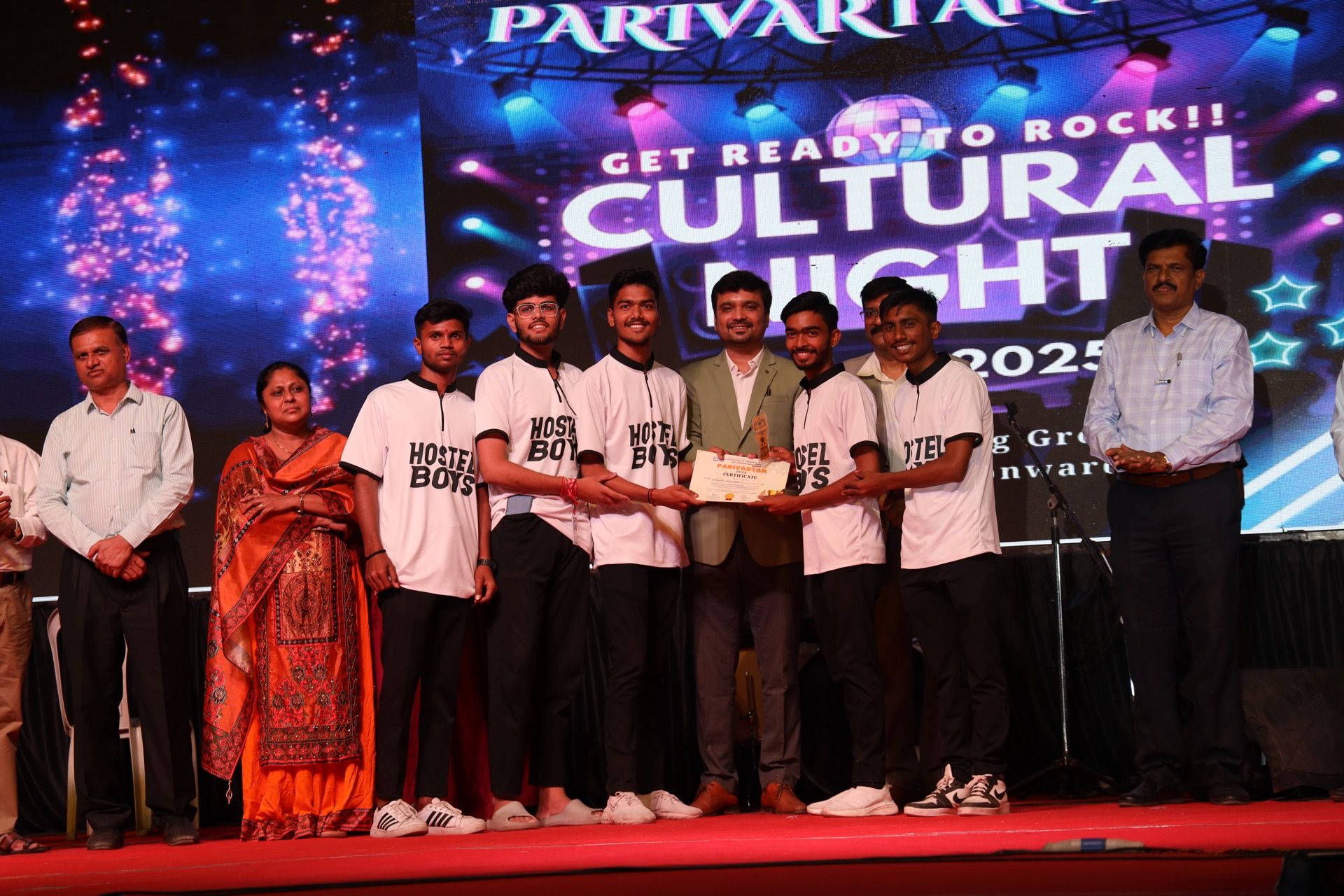 Avinash Chate on stage recognising students at a student-leadership session